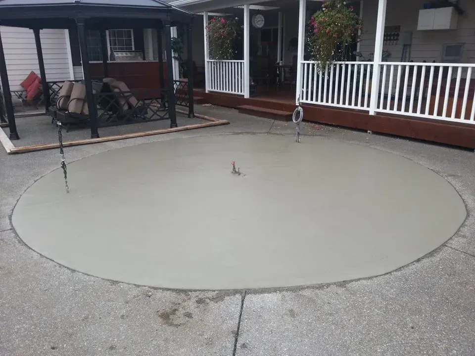 Circular concrete patio insert with smooth broom finish