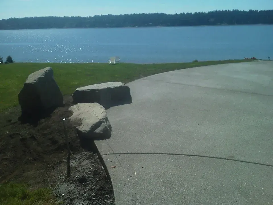 Large exposed aggregate concrete patio overlooking the South Puget Sound