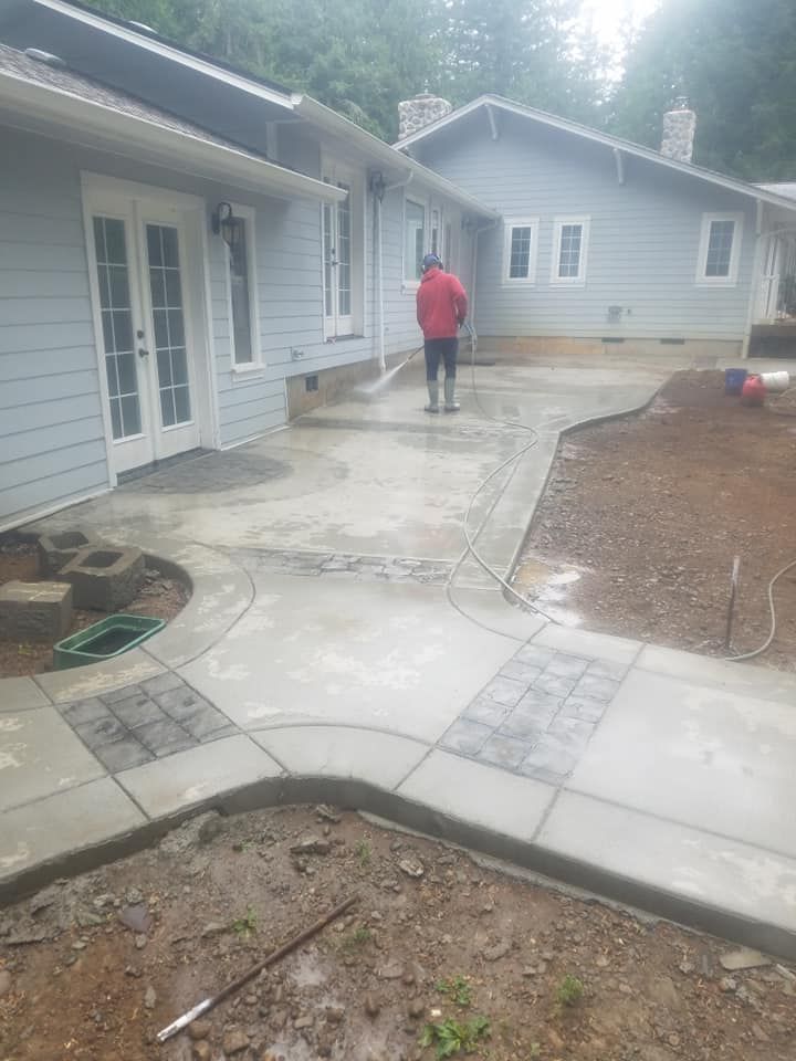 Decorative concrete walkway with stamped accent inlays