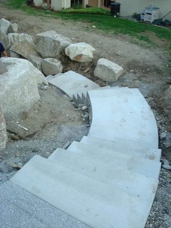 Custom formed concrete stairway with smooth trowel finish