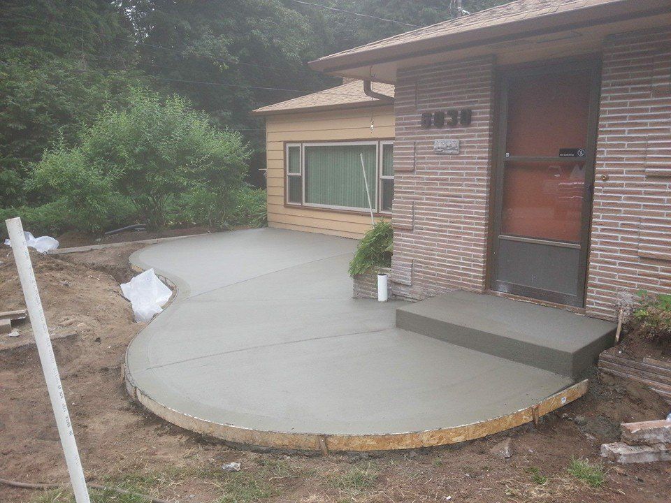 Front porch concrete slab with curved lines installed in Lacey, WA