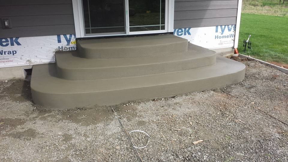 Curved concrete entry steps with smooth finished surface