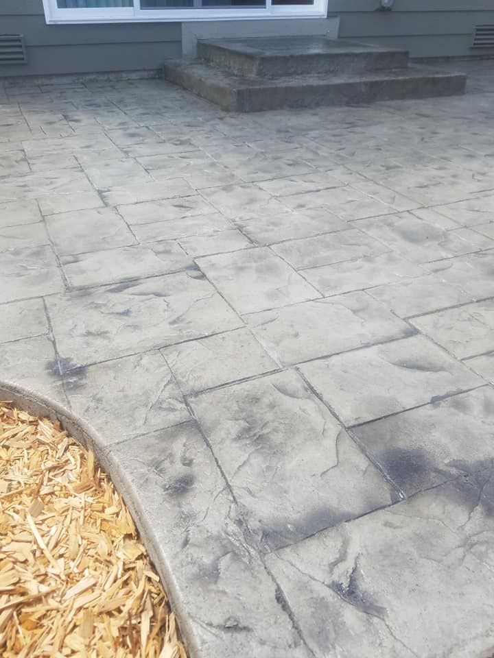 Professional concrete contractor creating patterned patio design