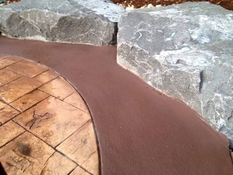 Residential concrete flatwork with multi-tone stain and curved edge
