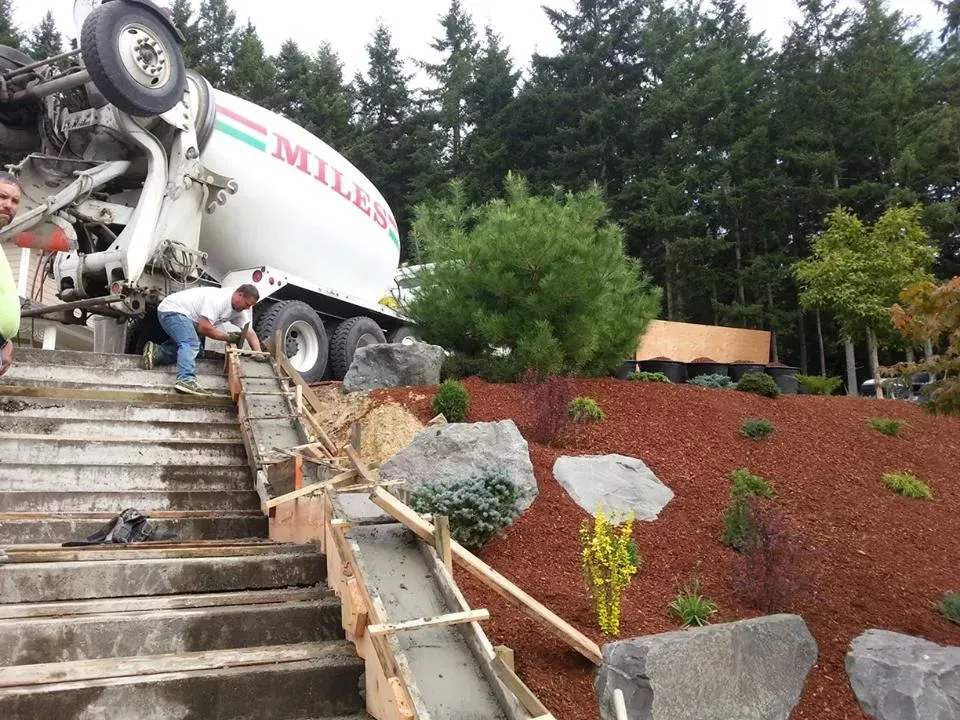 Custom poured concrete steps with reinforced framing and landscape integration