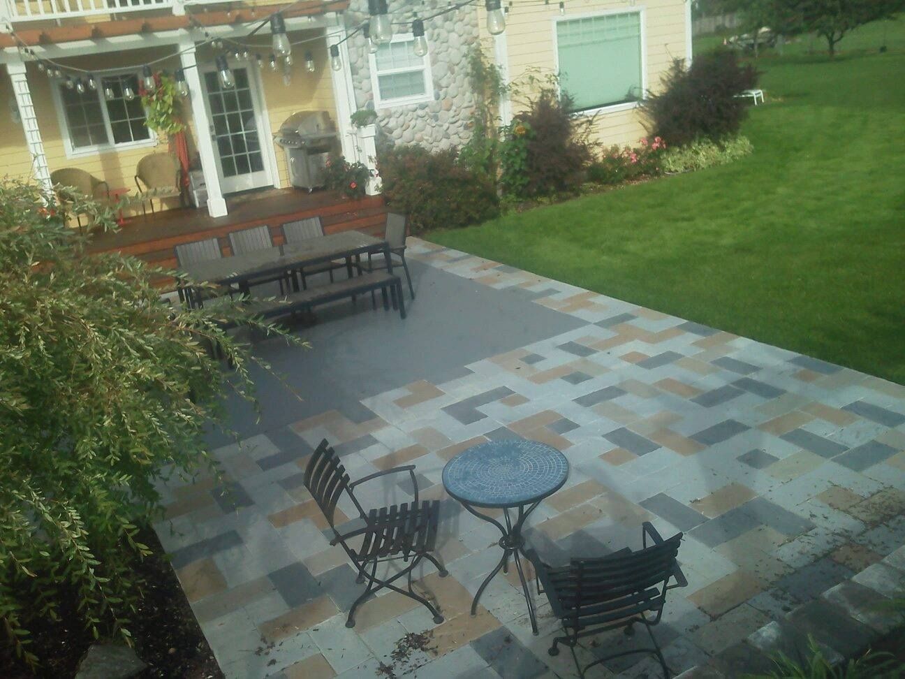 Decorative ashlar stamped concrete backyard patio