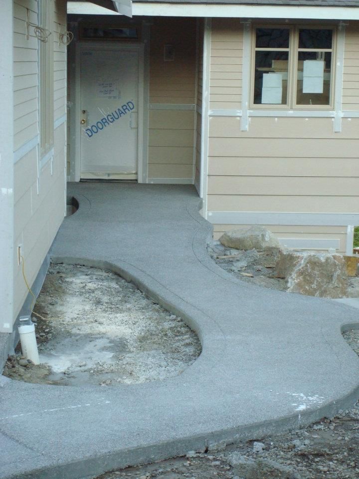Custom formed concrete pathway with rounded border detail