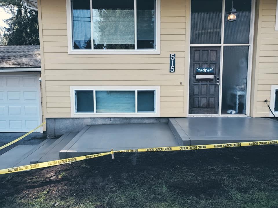 Modern front entry stairs with large walkways and clean lines