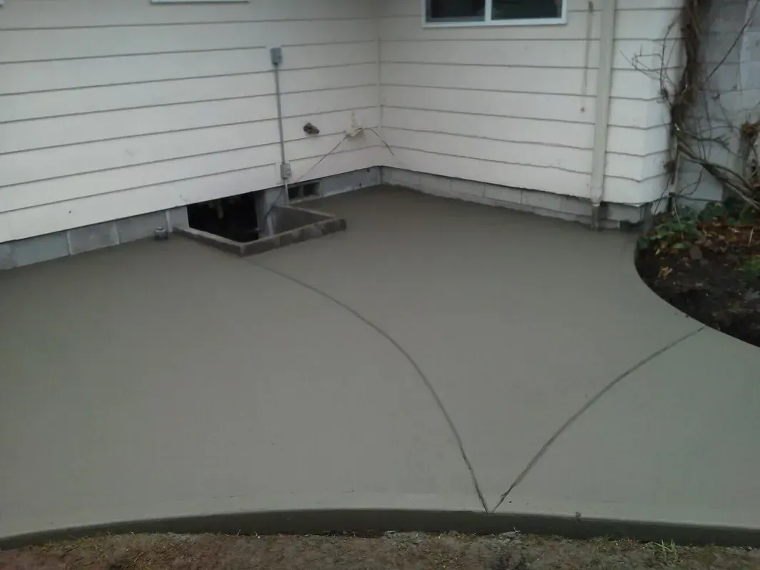 Custom poured concrete patio with rounded edge detail
