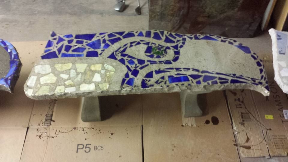 Handcrafted concrete bench featuring Seahawks inspired artwork