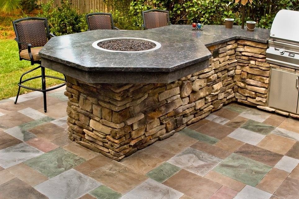 Custom concrete fire table with stone base and built in fire feature