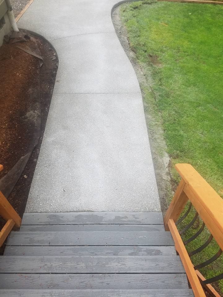 Curved broom finish concrete sidewalk with smooth edge forming and custom curves