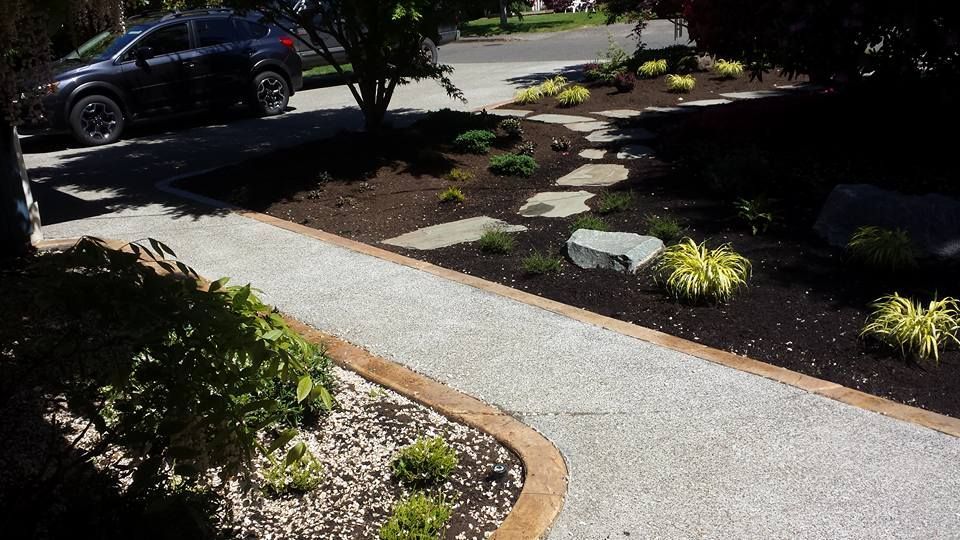 Custom exposed aggregate concrete with landscape design