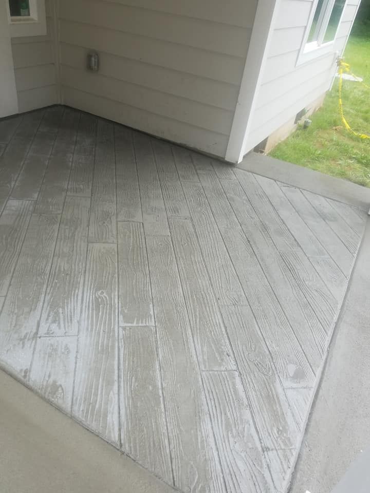 Wood plank stamped concrete patio with realistic wood grain texture
