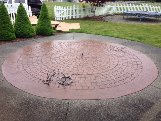 Colored concrete patio with radial pattern
Olympia WA stamped concrete patio contractor
