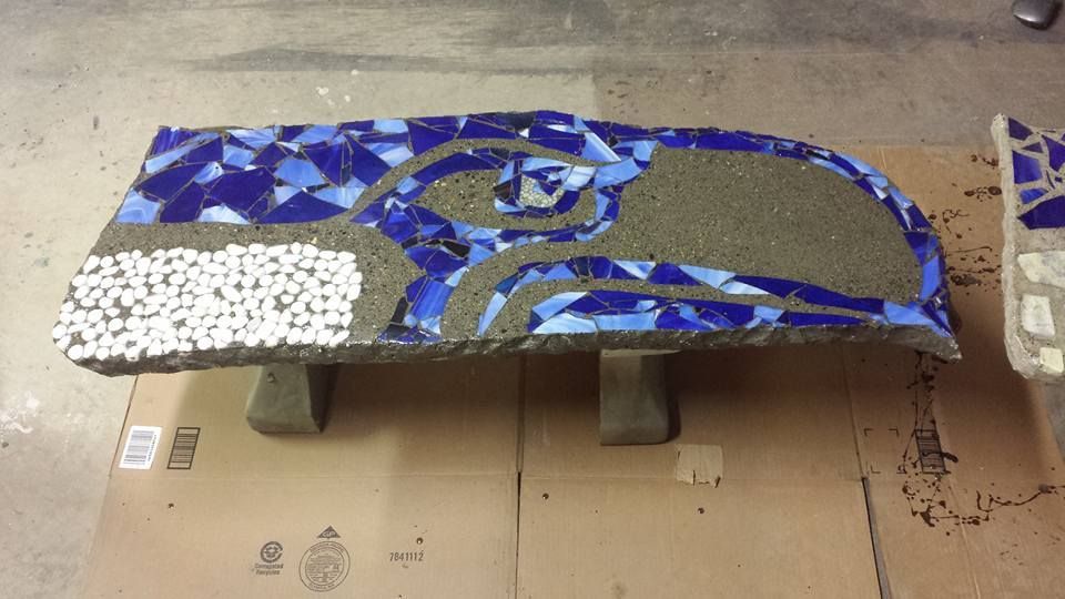 Custom decorative concrete seating with glass tile artwork