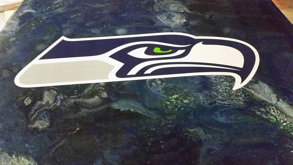 Custom concrete countertop with Seattle Seahawks logo inlay