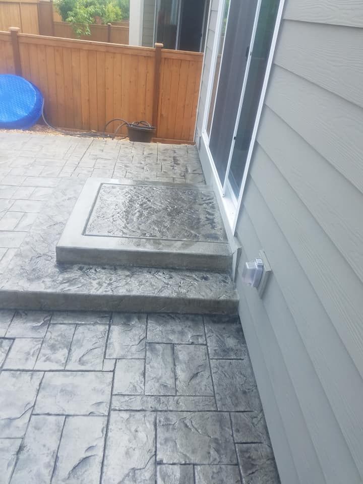 Textured concrete patio with ashlar stone pattern
