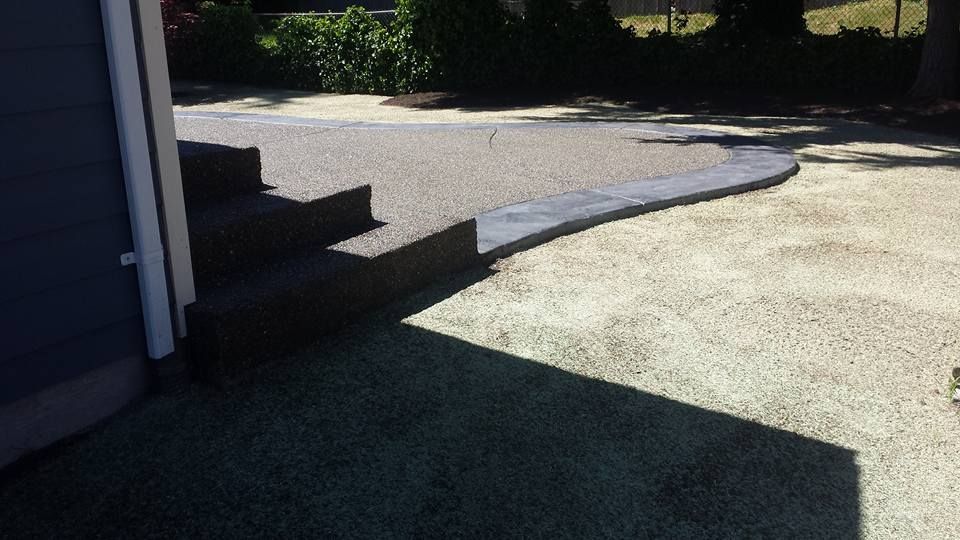 Custom multi-level concrete design with integrated steps and stamped border