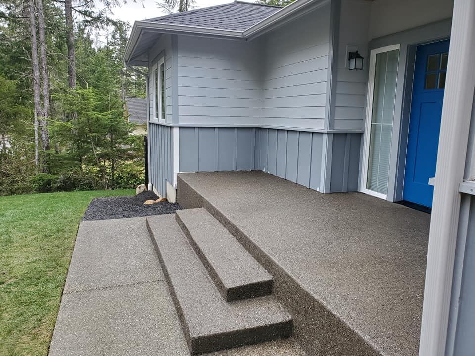 Exposed aggregate concrete porch with matching steps