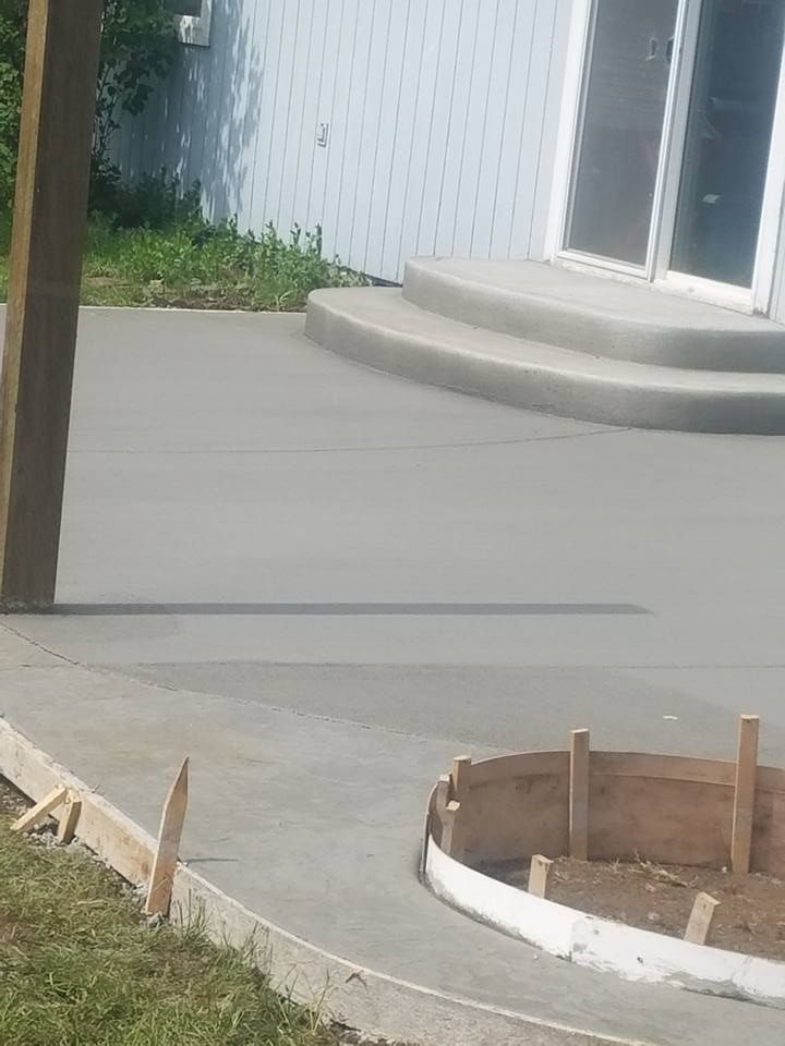 Residential concrete patio installation with smooth trowel finish