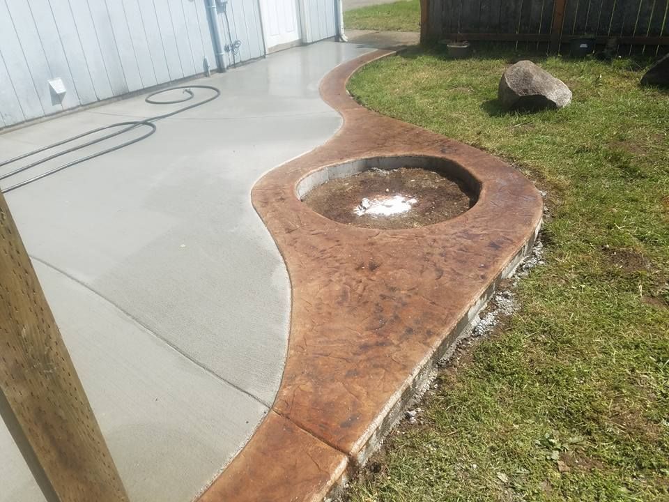 Lacey WA decorative concrete landscape edging and fire pit installation