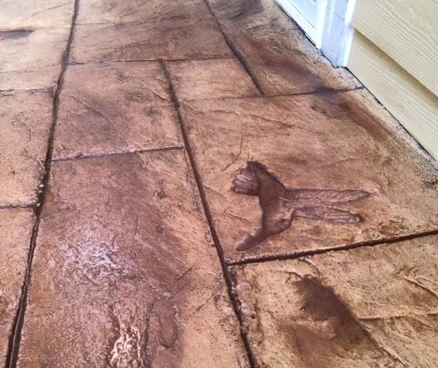 Residential concrete patio with detailed custom artwork