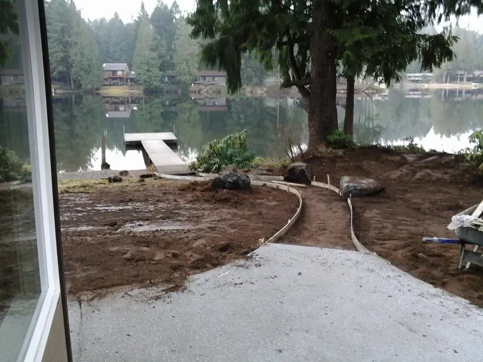 Residential custom designed concrete pathway to the waterfront dock 