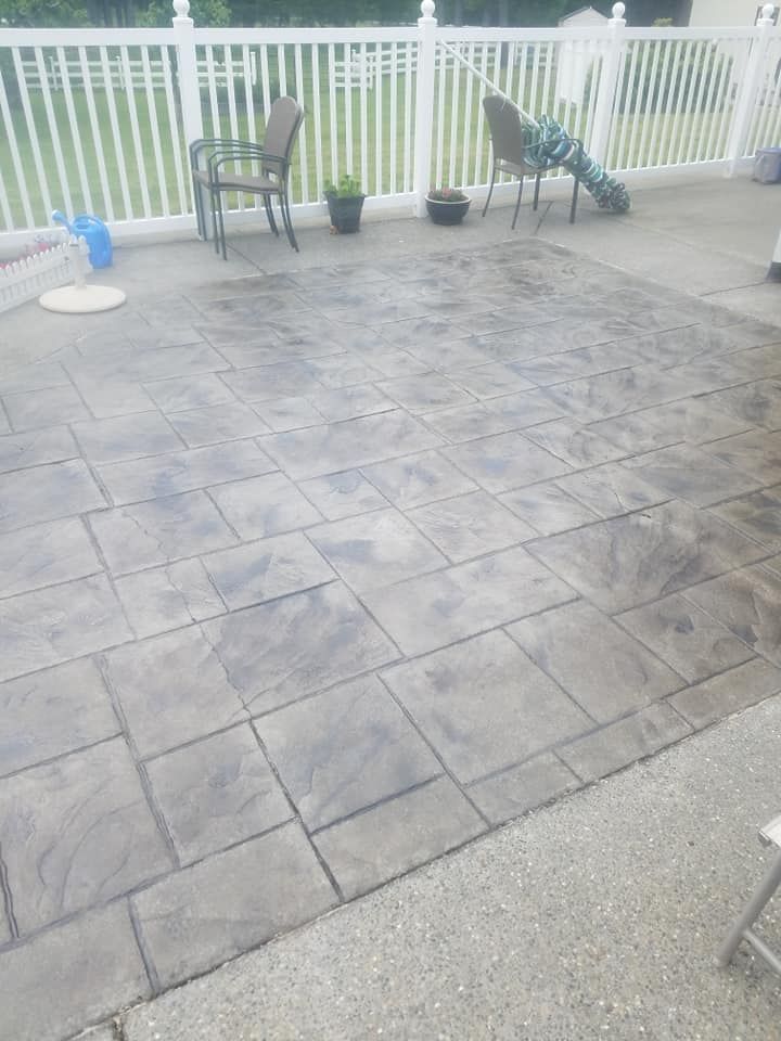 Residential outdoor living space with realistic stone imprint finish