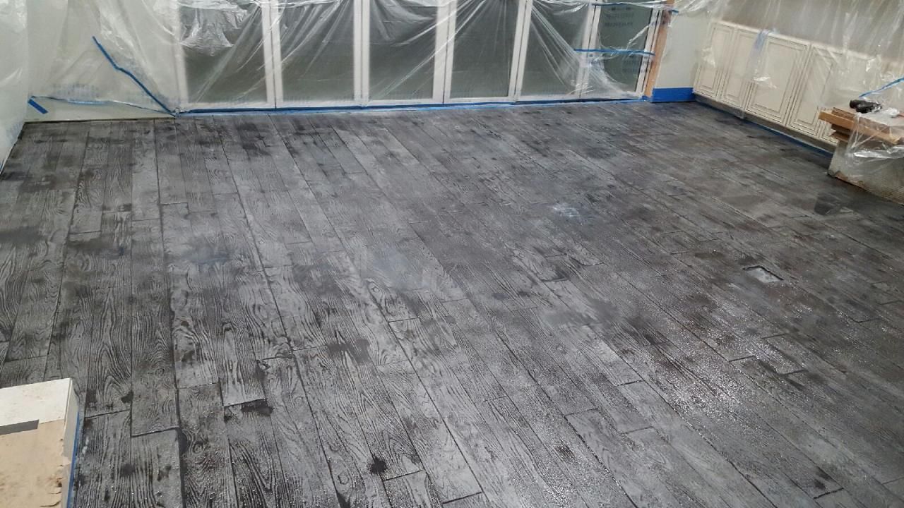 Seamless stamped concrete surface with custom plank layout
