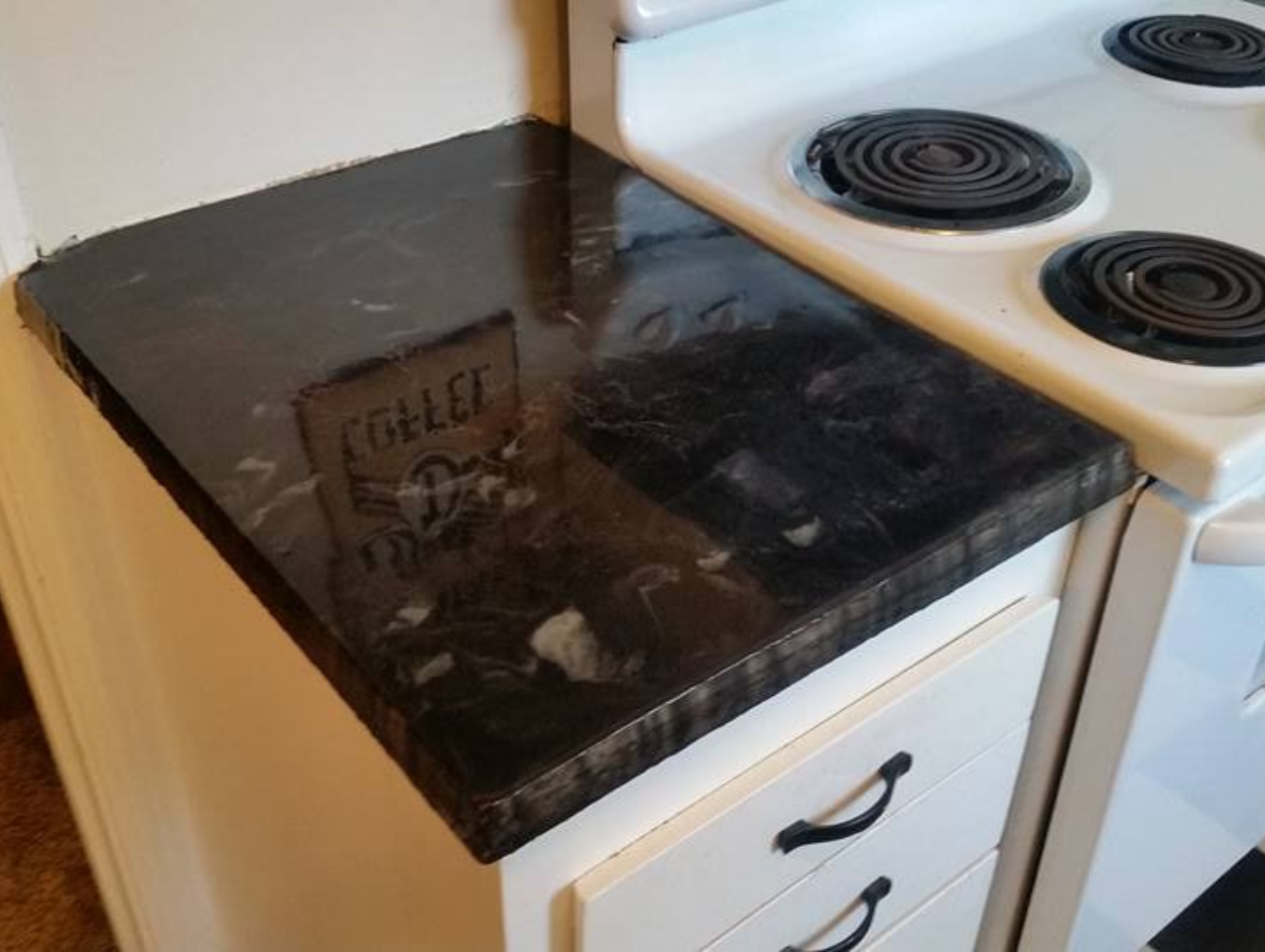 Custom concrete kitchen countertop with dark polished finish