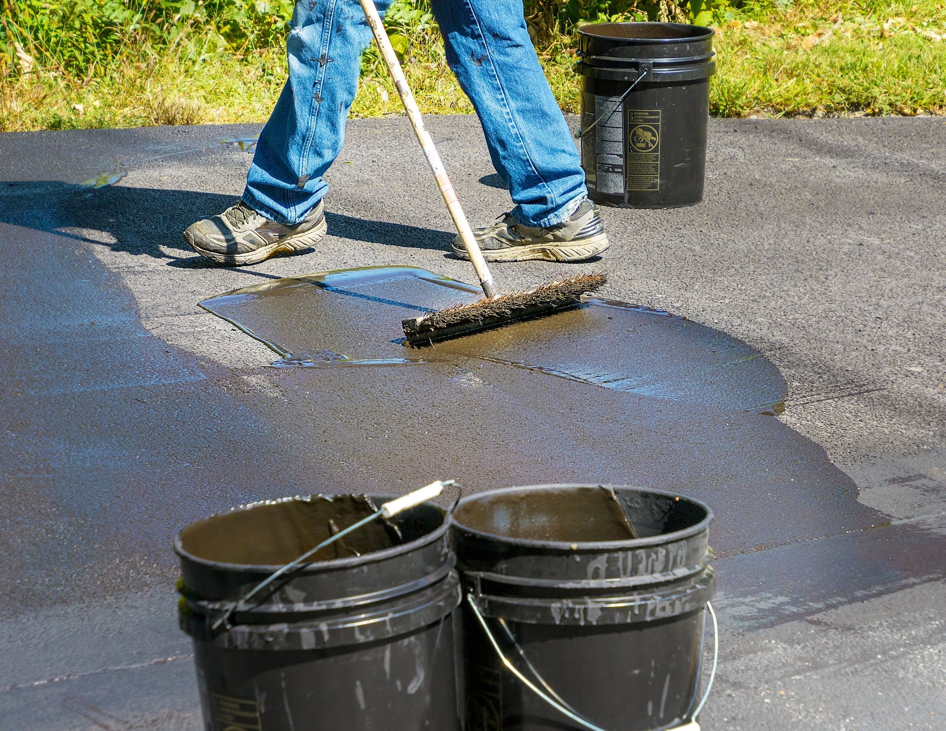 Image of a driveway being repaired and resealed.