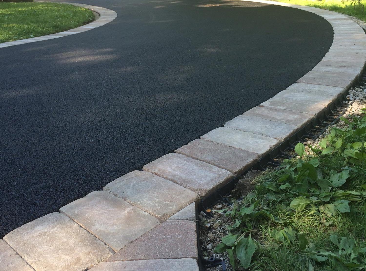 Image of a driveway being repaired and resealed.