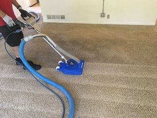 Man vaccuuming carpet — Upholstery Cleaning in Cañon City, CO - Canon Steam Way