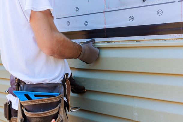 A ladder is attached to the side of a house.