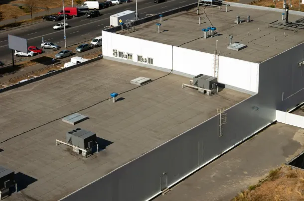 An aerial view of a large building with a flat roof