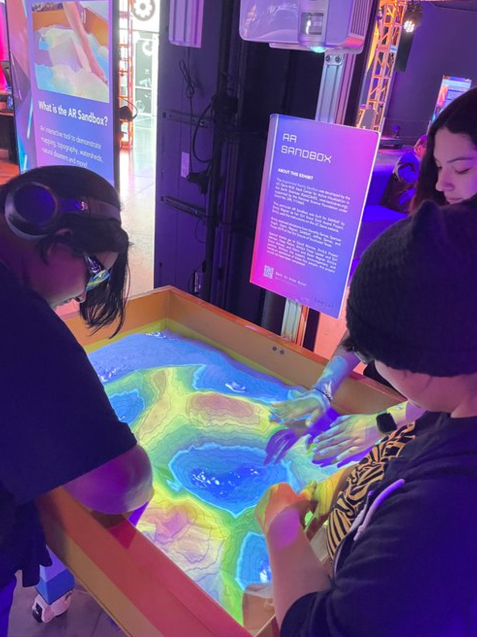 A group of people are playing a game on a table.