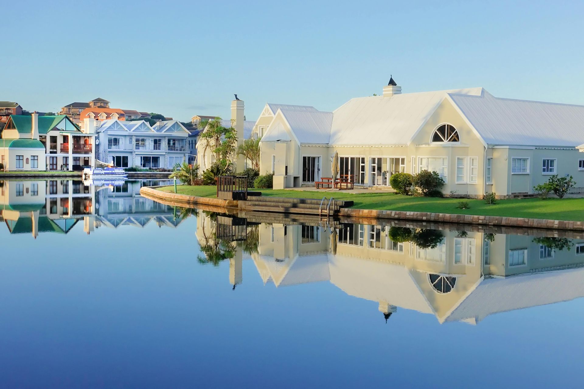 Image of high-end luxury house by the river.