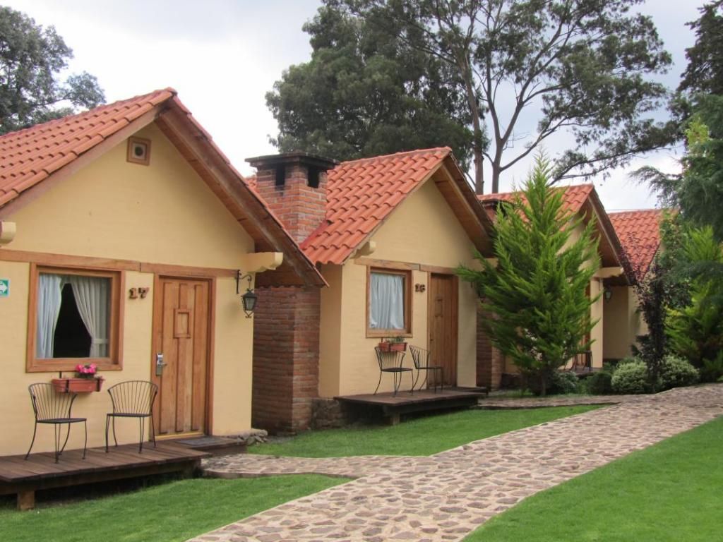 A row of small houses with red tile roofs