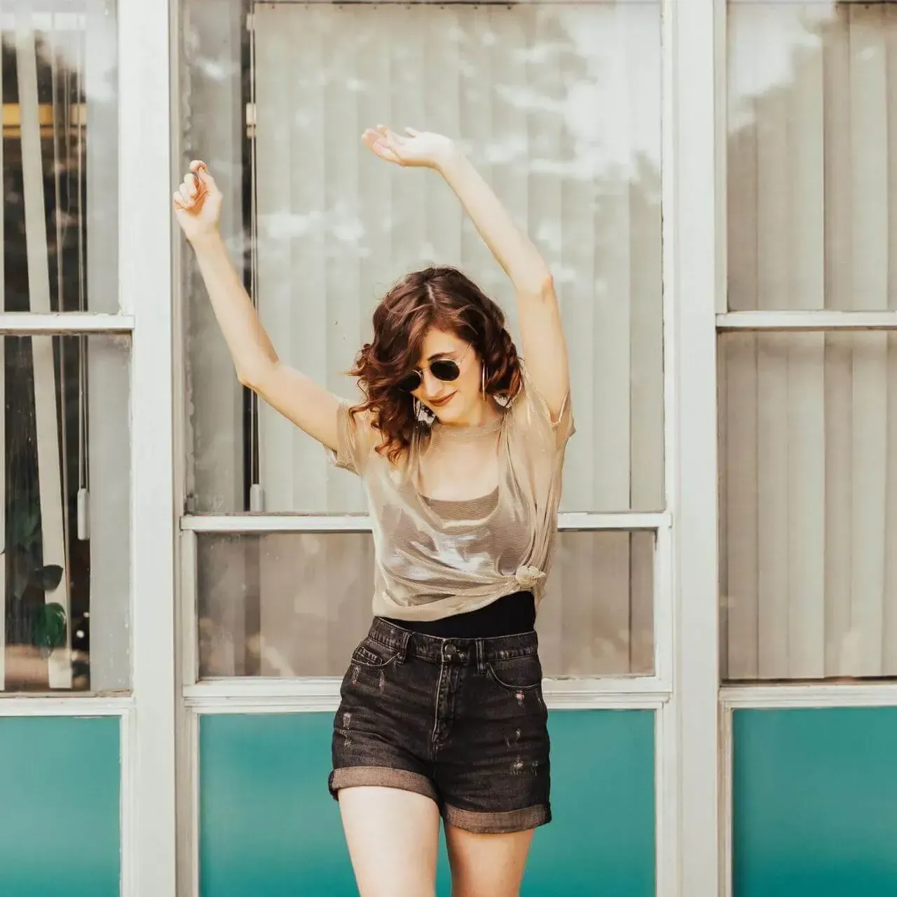 Happy Woman Waving Arms in Air - Dental Facial Aesthetics Christchurch - Duxton Dental