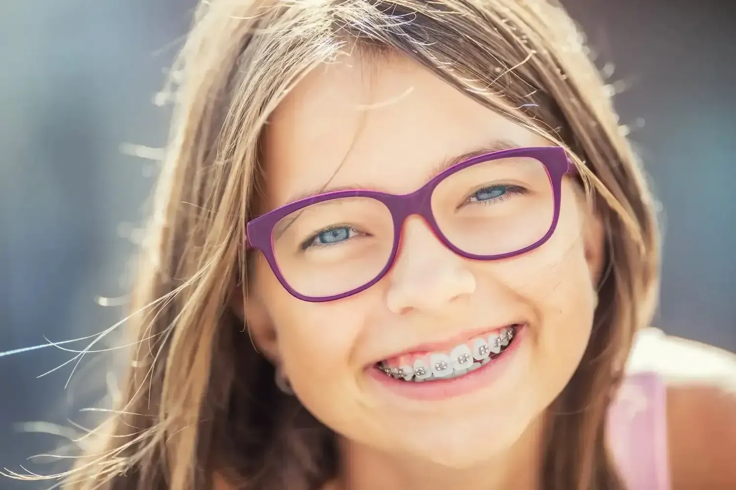 Girl With Glasses and Orthodontic Braces - Orthodontic Treatment Christchurch