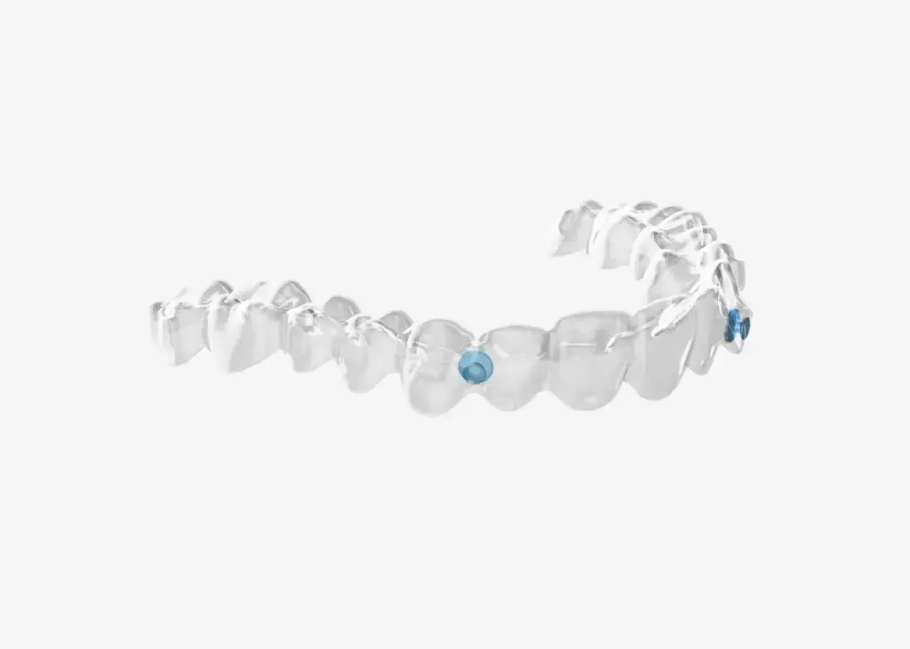 A close up of a pair of clear braces on a white background.
