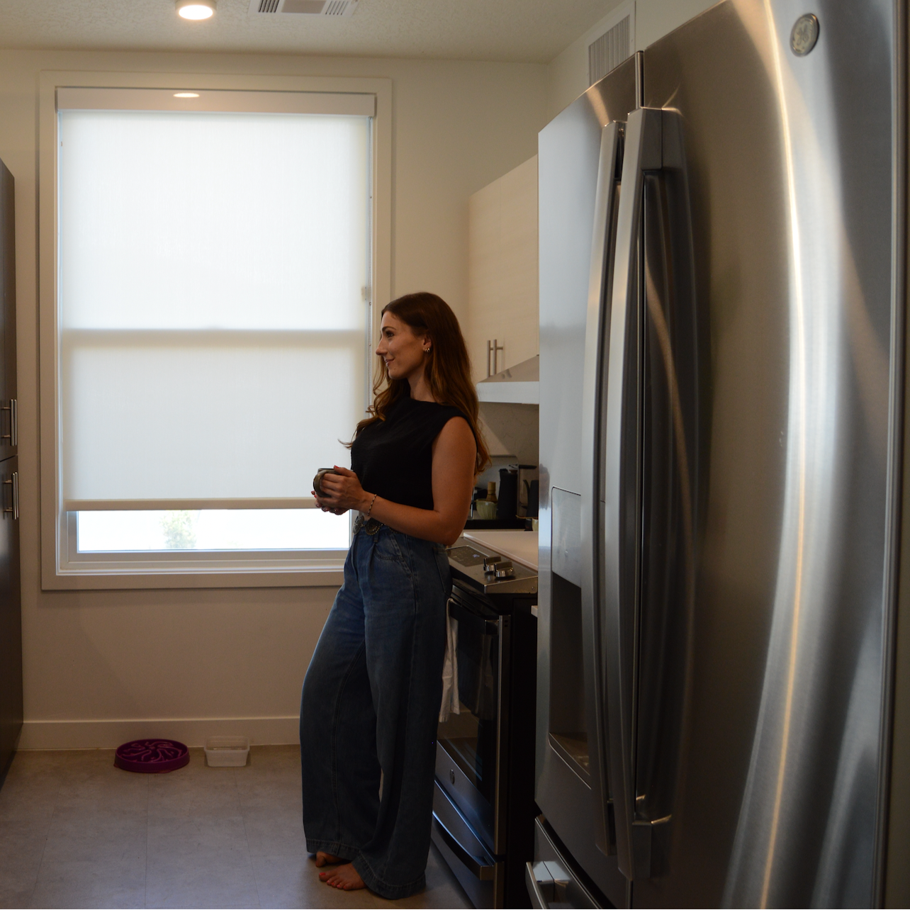 Dietitian Alexandra standing in her kitchen