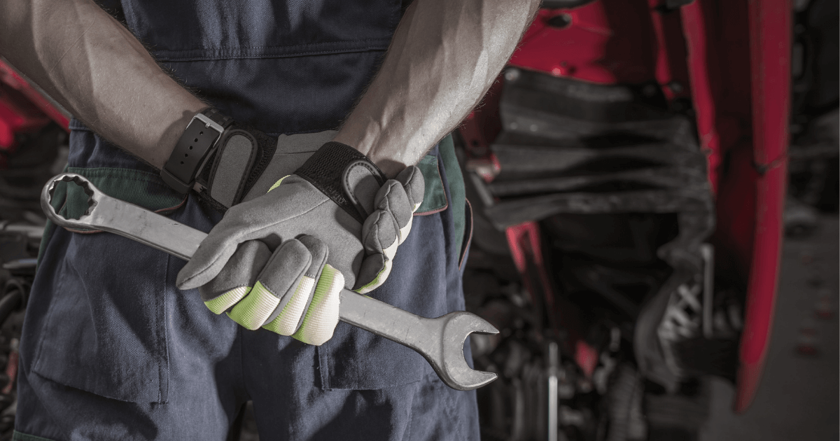 a mechanic holding a wrench in Baytown Tx