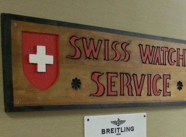 Photo of our company name and swiss logo