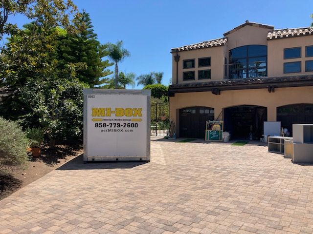 A large house with a big box in front of it