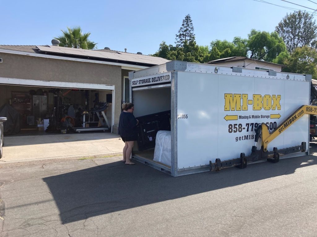 home owner loading portable storage container