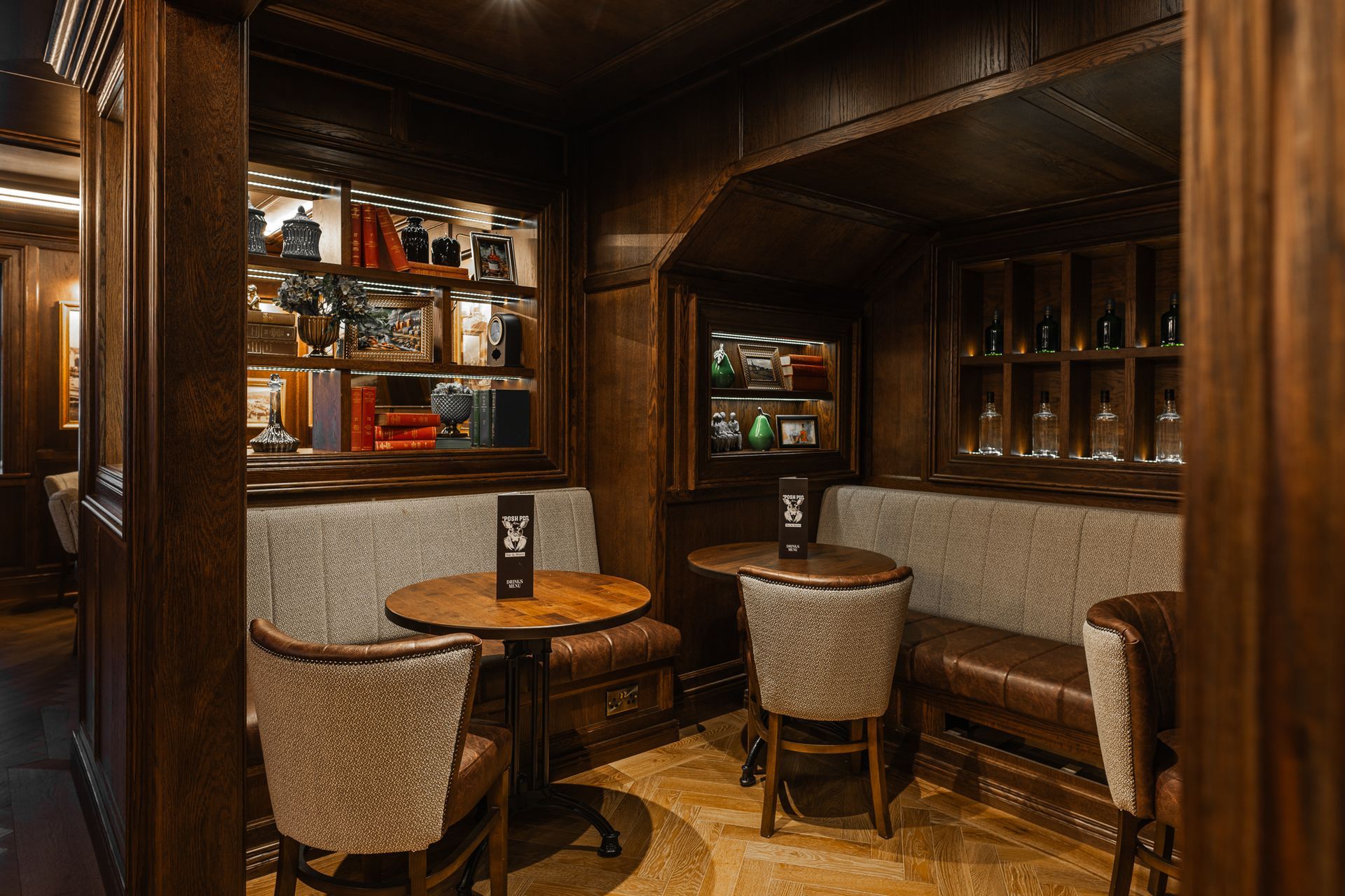 A room with tables and chairs in a restaurant.