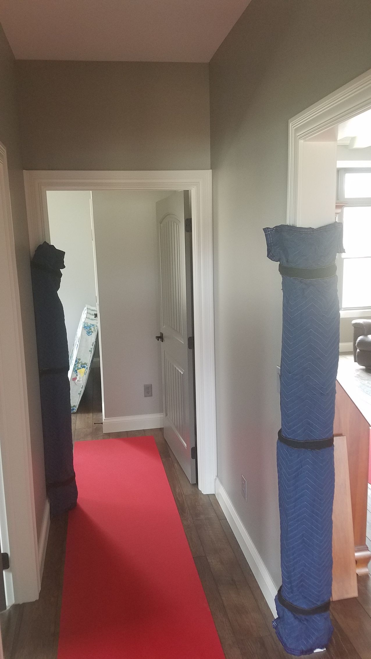 a hallway with a red carpet and a sign that says ' fragile ' on it