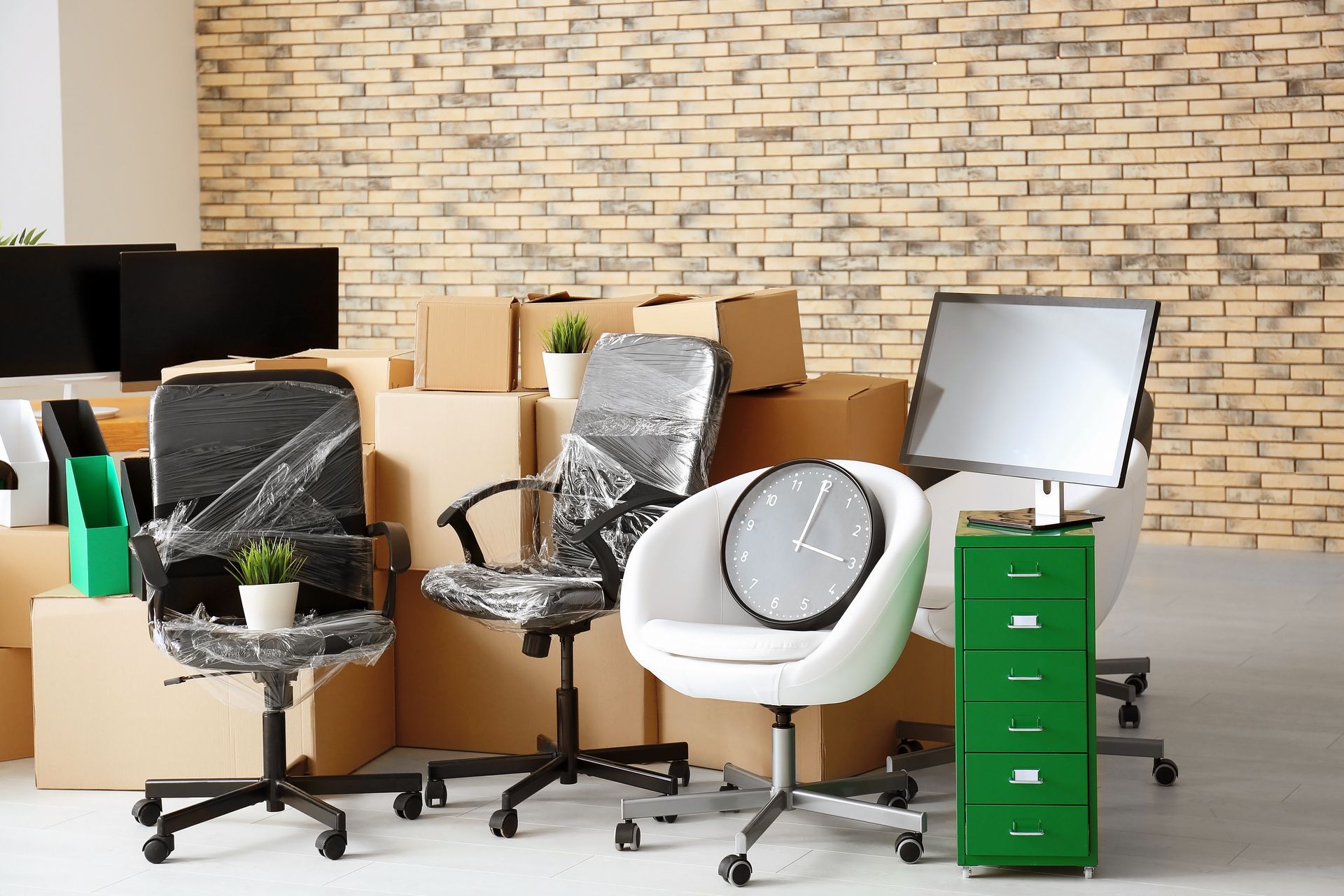 office space with packed boxes and furniture